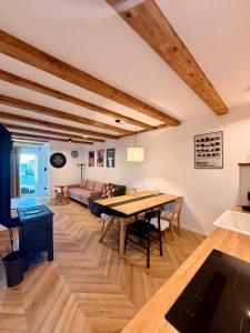 a living room with a table and a couch at Blisko in Kuźnica