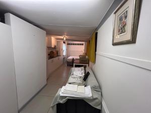 a small hallway with a bed in a room at The Pearl at Strand in Strand