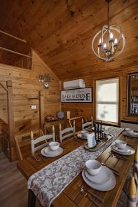 a dining room with a table in a log cabin at Red Cedar Haven Lakeside Tranquility in Sidney