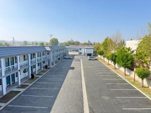 an empty parking lot with a row of buildings at Royale Inn 老爺客棧 - San Gabriel, Los Angeles in Rosemead