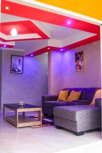 a living room with a couch and a table at The Rest in Maseru