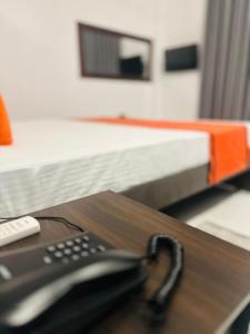 a remote control sitting on top of a table at Shrek Villa in Balapitiya