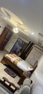 a bedroom with two beds in a room at Keur Mame Coumba in Saint-Louis