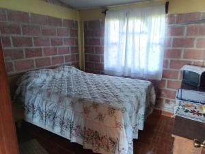 Postel nebo postele na pokoji v ubytování Cabaña Jilotepec, ALDEA el corazon de la montaña de 2 habitaciones