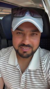 a man wearing a hat and glasses on his head at Maison in Vétroz