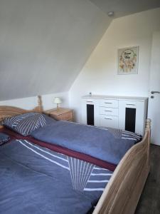 Ένα ή περισσότερα κρεβάτια σε δωμάτιο στο Schröder's Ferienwohnung