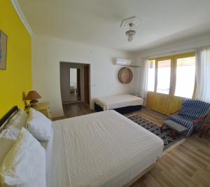 Postel nebo postele na pokoji v ubytování Uğrak Home