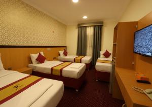 Μια τηλεόραση ή/και κέντρο ψυχαγωγίας στο فندق رفاق مكة +45 φωτογραφίες