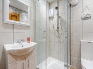 a bathroom with a sink and a shower at The Forge - Uk45460 in Loftus +4 photos