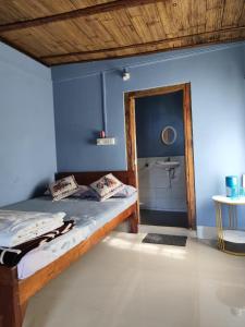 Postel nebo postele na pokoji v ubytování Sylvan homestay