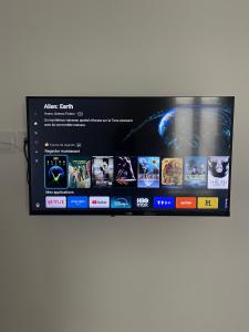 a shelf with a bunch of video games on it at Studio F lumineux refait à neuf in Troyes