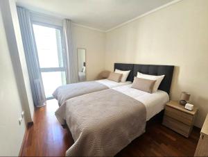 Postel nebo postele na pokoji v ubytování Wings Apartment + 10 fotografií