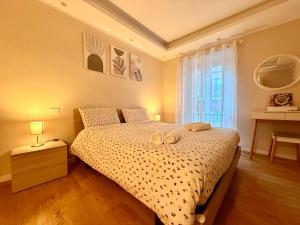 a bedroom with a bed with two towels on it at Casa Kiara by KALMA in Domodossola