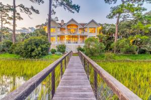 a house on a bridge over a lake at MG3083: 3083 Marshgate in Seabrook Island