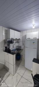 Η κουζίνα ή μικρή κουζίνα στο Kitnet +4 φωτογραφίες