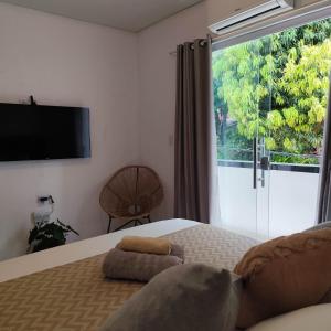 Ένα ή περισσότερα κρεβάτια σε δωμάτιο στο Apto Equipado Próximo às Praias de Itacaré Sunset1e3