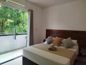 Ένα ή περισσότερα κρεβάτια σε δωμάτιο στο Apto Equipado Próximo às Praias de Itacaré Sunset1e3