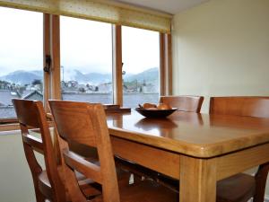 a dining room table with chairs and a bowl on it at Upper Sycamore Cottage in Ambleside