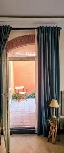 a room with a door open to a patio at Blu Oltremare camere bijoux in Varazze +170 photos