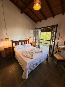 Postel nebo postele na pokoji v ubytování Casa Ilhabela vista Mar Perequê