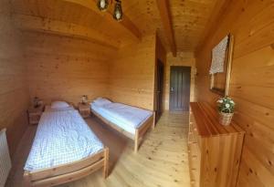 Postel nebo postele na pokoji v ubytování Chata RAIKA