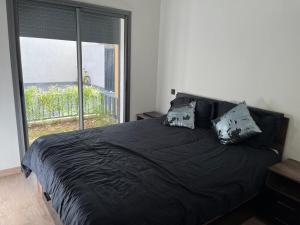 Ένα ή περισσότερα κρεβάτια σε δωμάτιο στο Résidence Natura Living