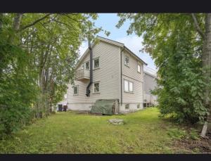 a large house in the middle of a yard at Apartment in central Kirkenes in Kirkenes