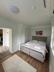 a bedroom with a bed in a room at Villa Linnea in Hanko