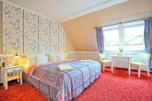 Postel nebo postele na pokoji v ubytování Hotel Godewind