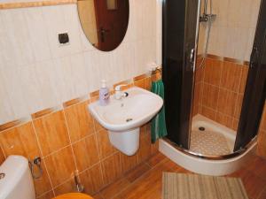 a bathroom with a sink and a shower at Holiday Home Kolczewo near Baltic Sea Beach in Kołczewo +14 photos