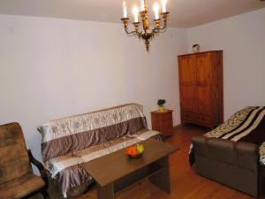 a living room with a couch and a table at Holiday Home Kolczewo near Baltic Sea Beach in Kołczewo