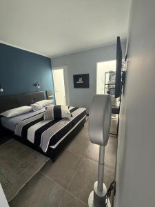 a bedroom with two beds and a tv in it at Villa Claus in Puerto Calero +25 photos