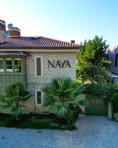 a building with the word naya written on it at naya port in Alacati