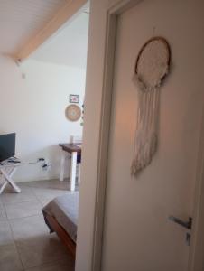 a room with a mirror hanging on the wall at Casa Tiale - Chapadmalal , Campo y Olas- in Colonia Chapadmalal