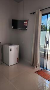 TV a/nebo společenská místnost v ubytování Marajó Suítes