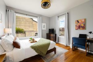 a bedroom with a bed and a window and a desk at Downtown Home Walk to Restaurants and Waterfront in Tacoma