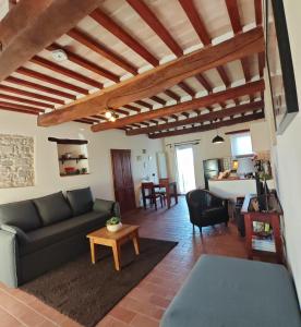 a living room with a couch and a table at Casa Ripa North in Cupramontana
