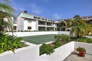 a tennis court in front of a building at Leadbetter Beach Retreat in Santa Barbara