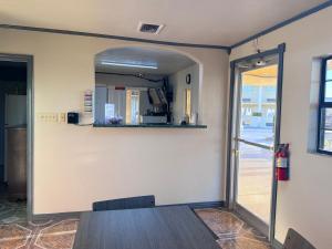 a dining room with a table and a mirror at Executive inn in Crystal City +16 photos