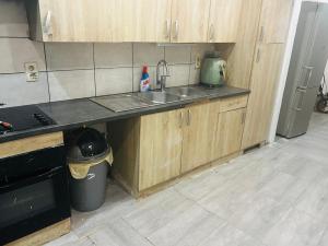 a kitchen with a sink and a counter top at Christalsuite in Frameries