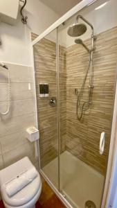 a bathroom with a shower and a toilet at La Casa Di Nonna Tella in Lenola