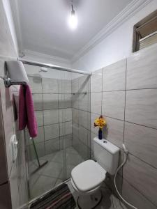 a bathroom with a toilet and a shower at Casa no Sítio - Guaramiranga in Guaramiranga
