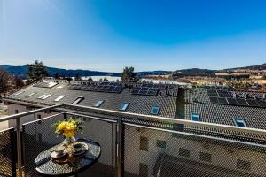 a view of a building with solar panels on the roof at Výhledna Lipno Korzo in Lipno nad Vltavou