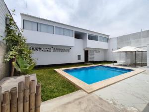 a swimming pool in the backyard of a house at Apartment with Beach Exit 204 in Punta Negra