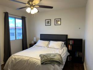 a bedroom with a bed with a ceiling fan at Desert Dwelling Resort Near Papago Park in Phoenix