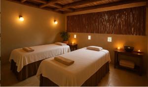 Ένα ή περισσότερα κρεβάτια σε δωμάτιο στο ARKA Tulum