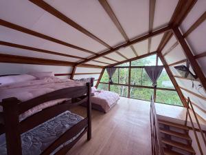 Ένα ή περισσότερα κρεβάτια σε δωμάτιο στο Cattaleya