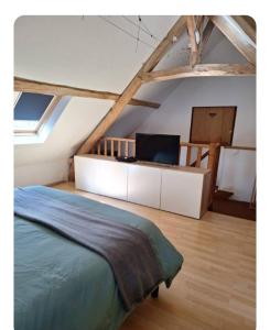 Ένα ή περισσότερα κρεβάτια σε δωμάτιο στο Les Petites Écuries