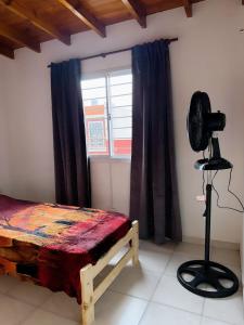 Ένα ή περισσότερα κρεβάτια σε δωμάτιο στο Vacaciones Mar del Tuyú