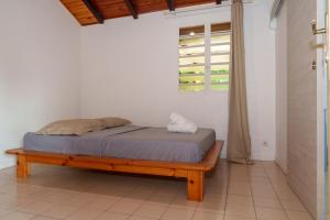 Ένα ή περισσότερα κρεβάτια σε δωμάτιο στο Villa Canelle